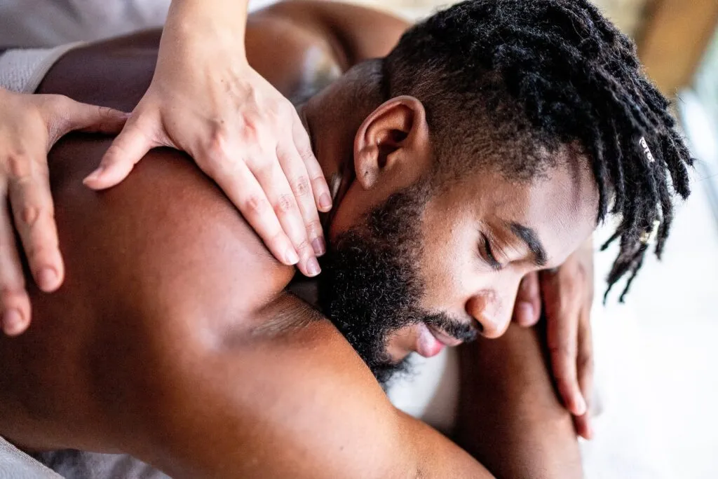 Professional tantric masseuse in London performing a sensual body to body massage